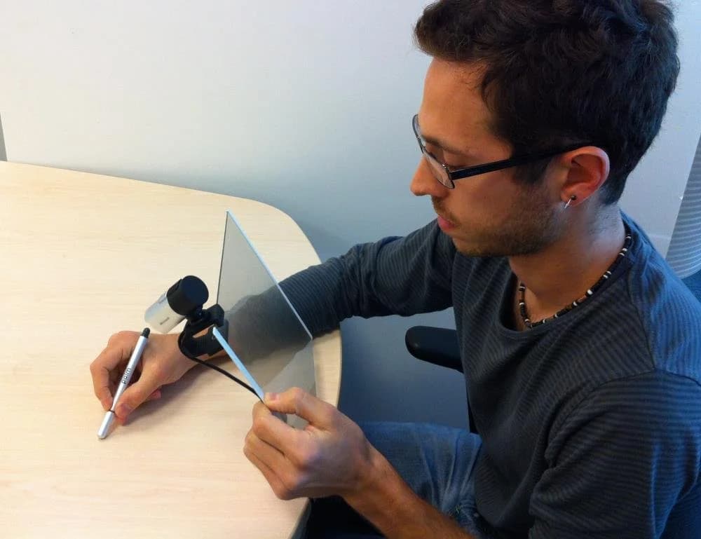 Side view of the augmented reality writing setup showing that nothing is visible on the table